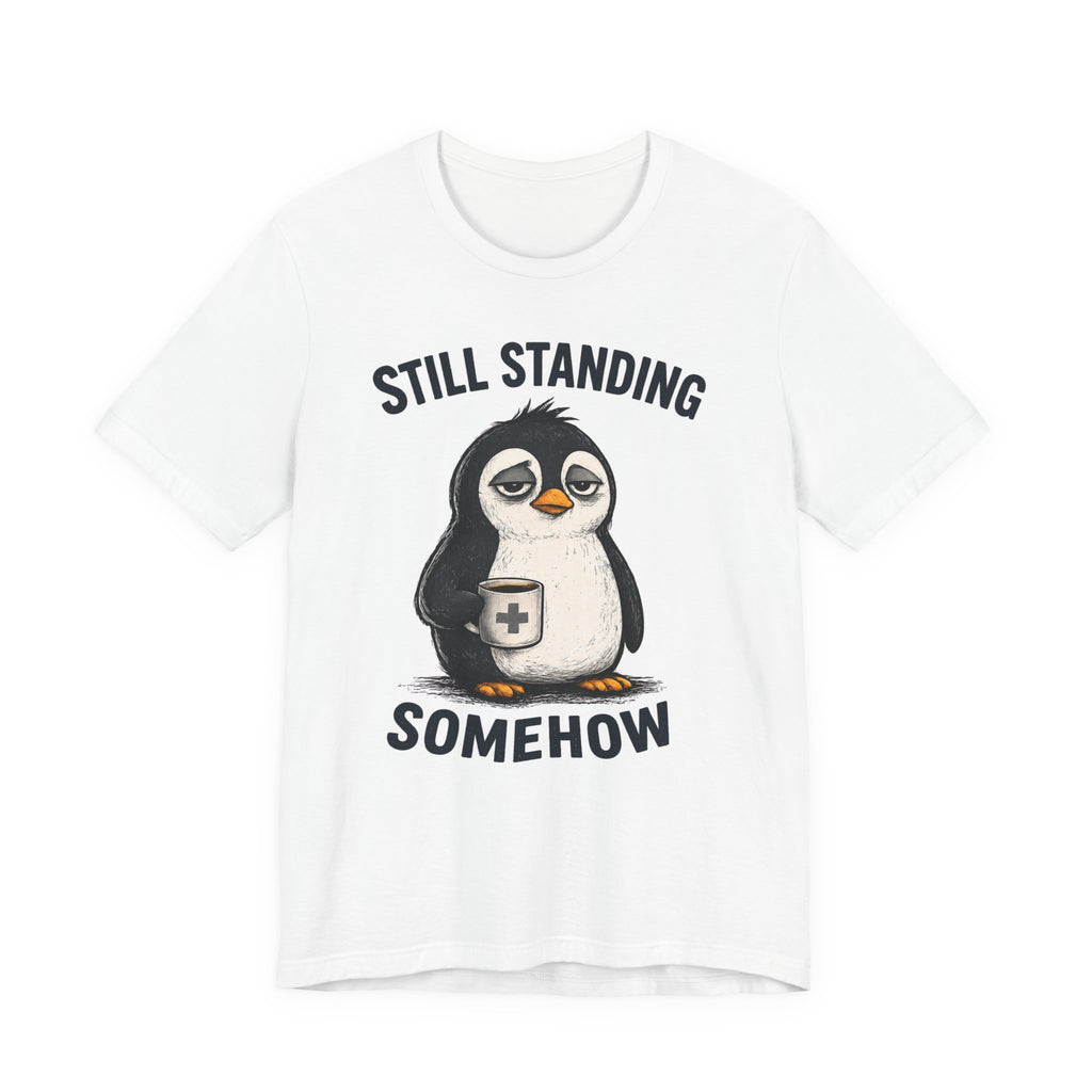 Still Standing Somehow Penguin T-Shirt – Cute Resilient Animal Graphic Tee
