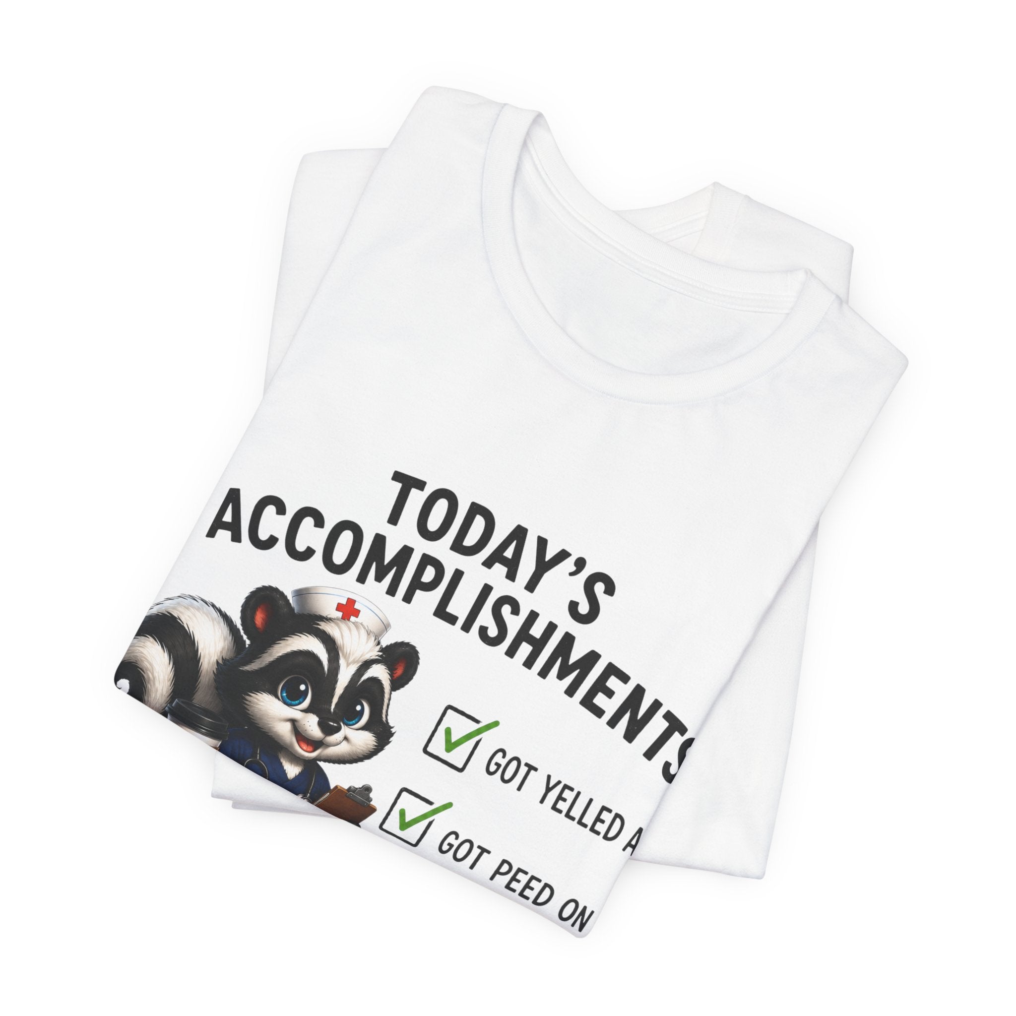 Tee — “Today’s Accomplishments: Got Yelled At, Got Peed On” Cute Skunk Checklist