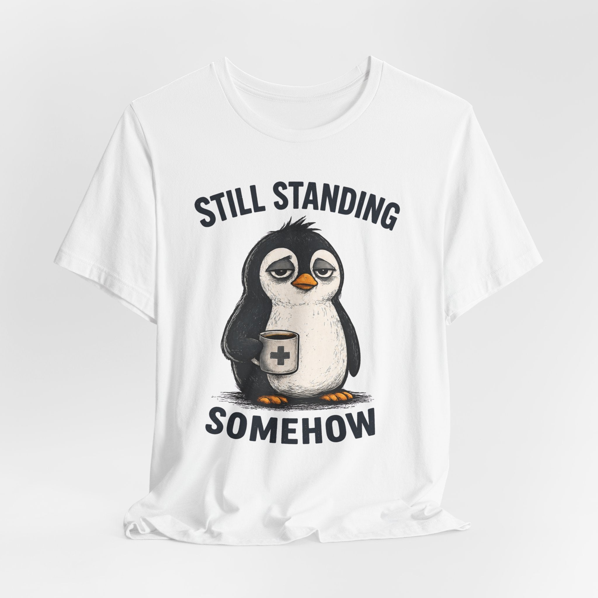 Still Standing Somehow Penguin T-Shirt – Cute Resilient Animal Graphic Tee