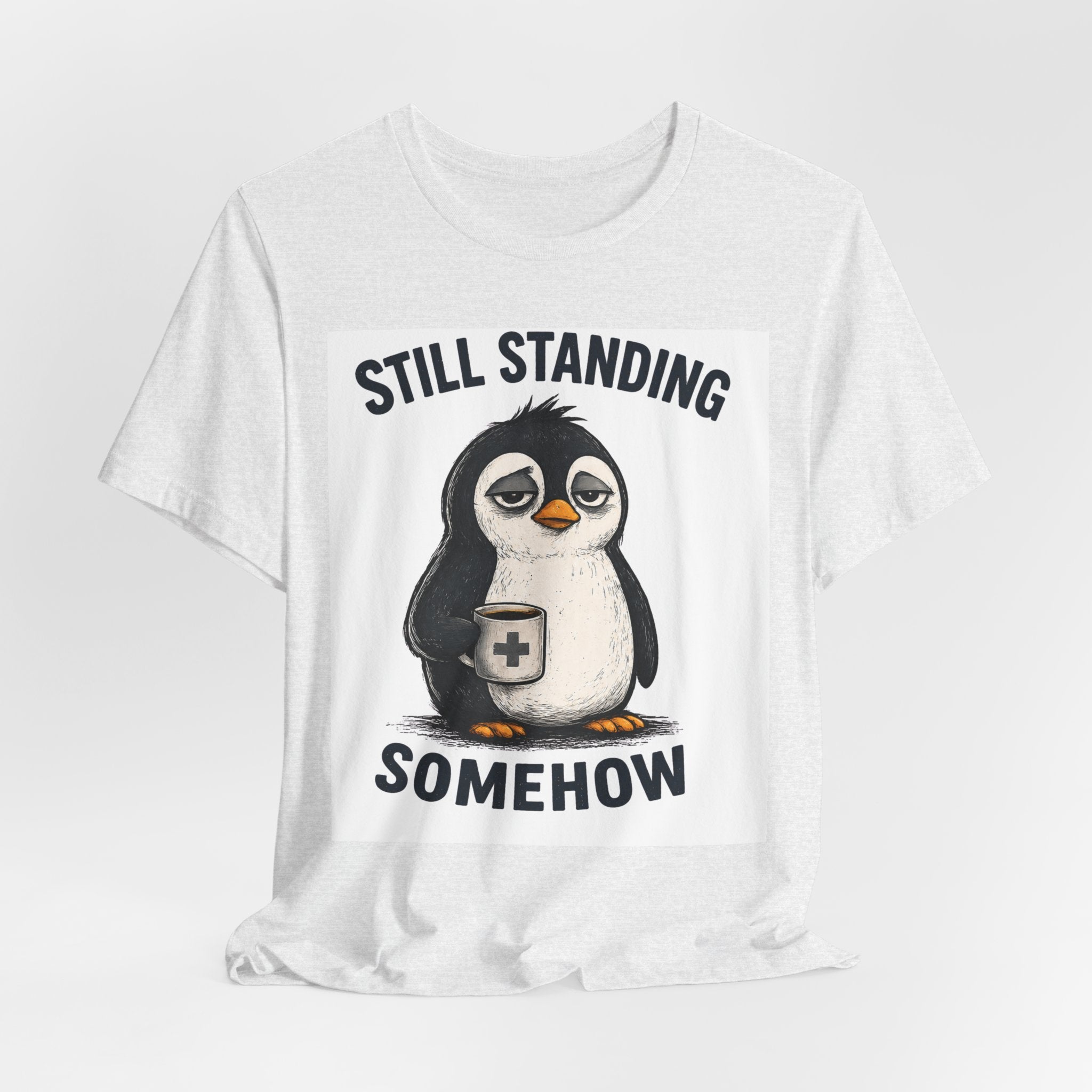 Still Standing Somehow Penguin T-Shirt – Cute Resilient Animal Graphic Tee